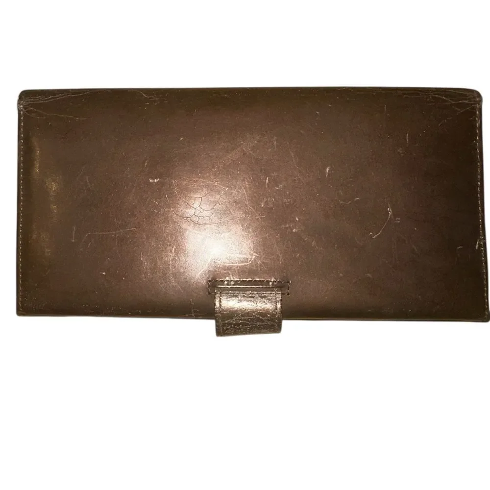 Yves Saint Laurent Tan Leather Wallet with Gold Clasp with marks and scratches.